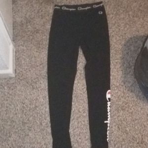 These are a pair of black champion leggings,with the champion logo,size:Medium